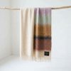 Manta Mohair Ezcaray Rayas Ocre y Lila
